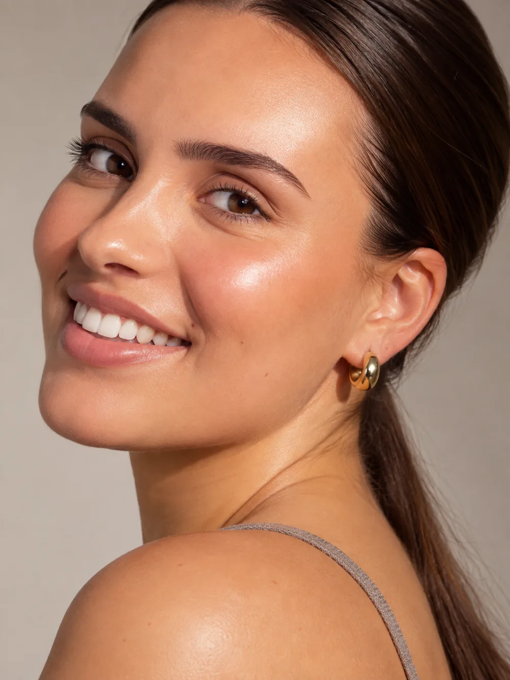 Smiling woman with smooth, glowing skin