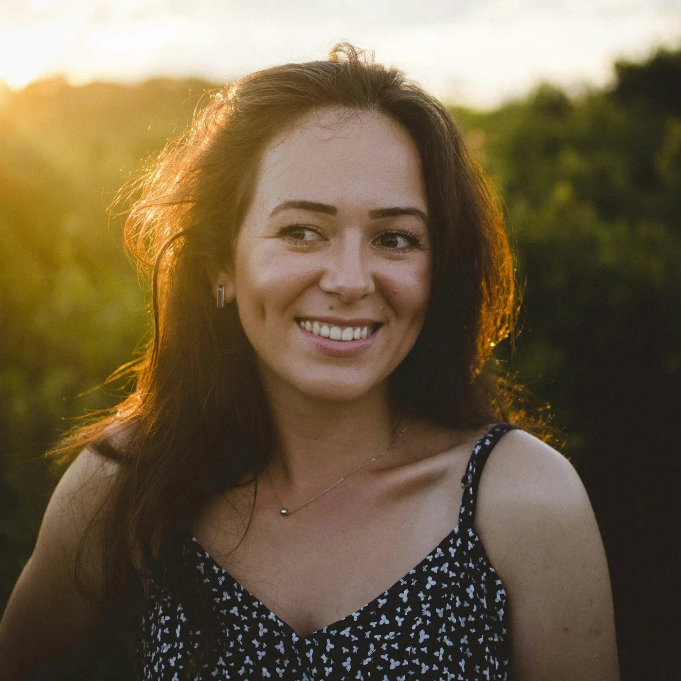 Smiling woman in warm sunlight