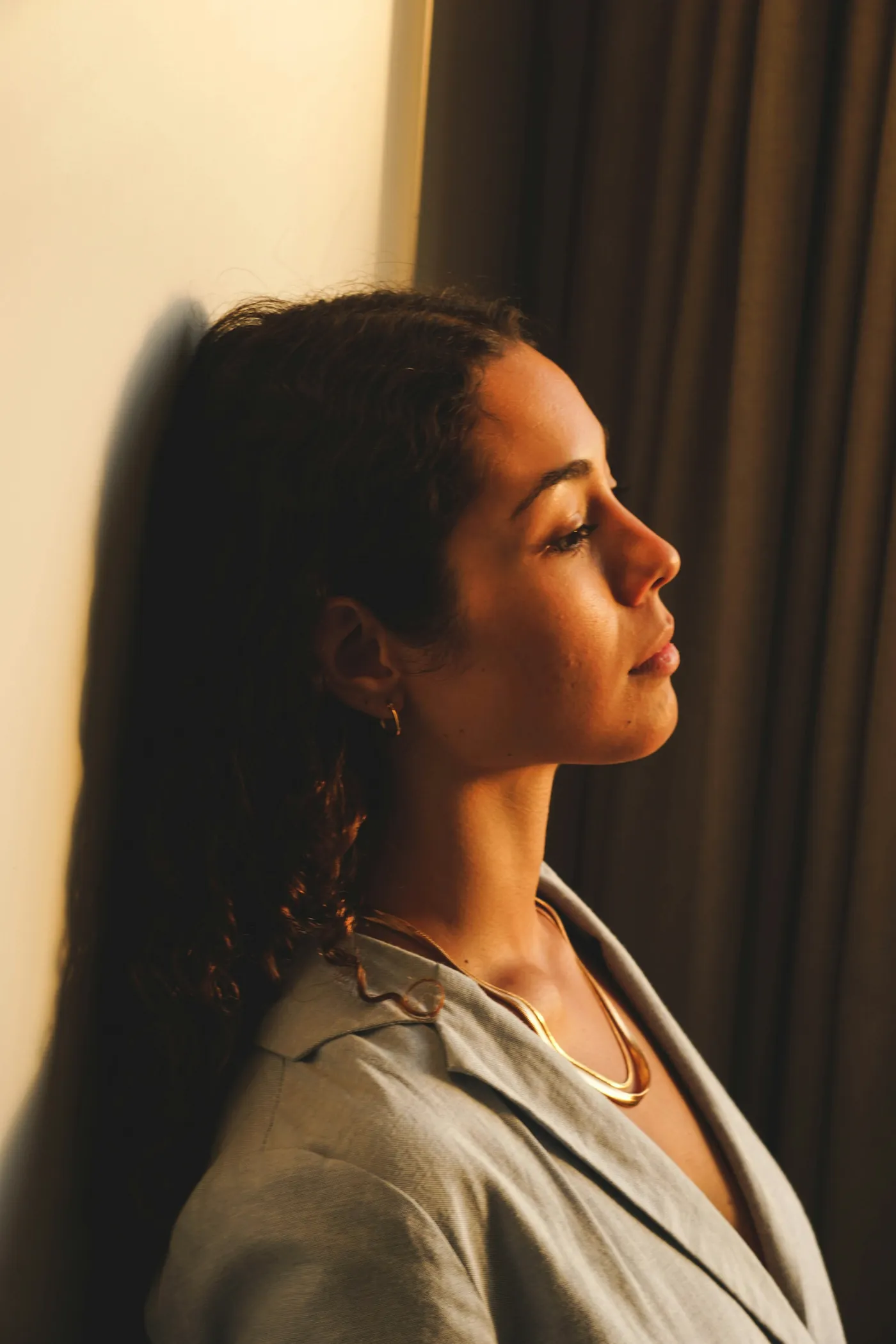 Woman in profile by a window