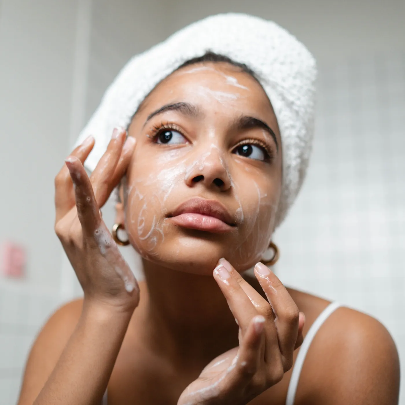 Woman washing her face before an appointment