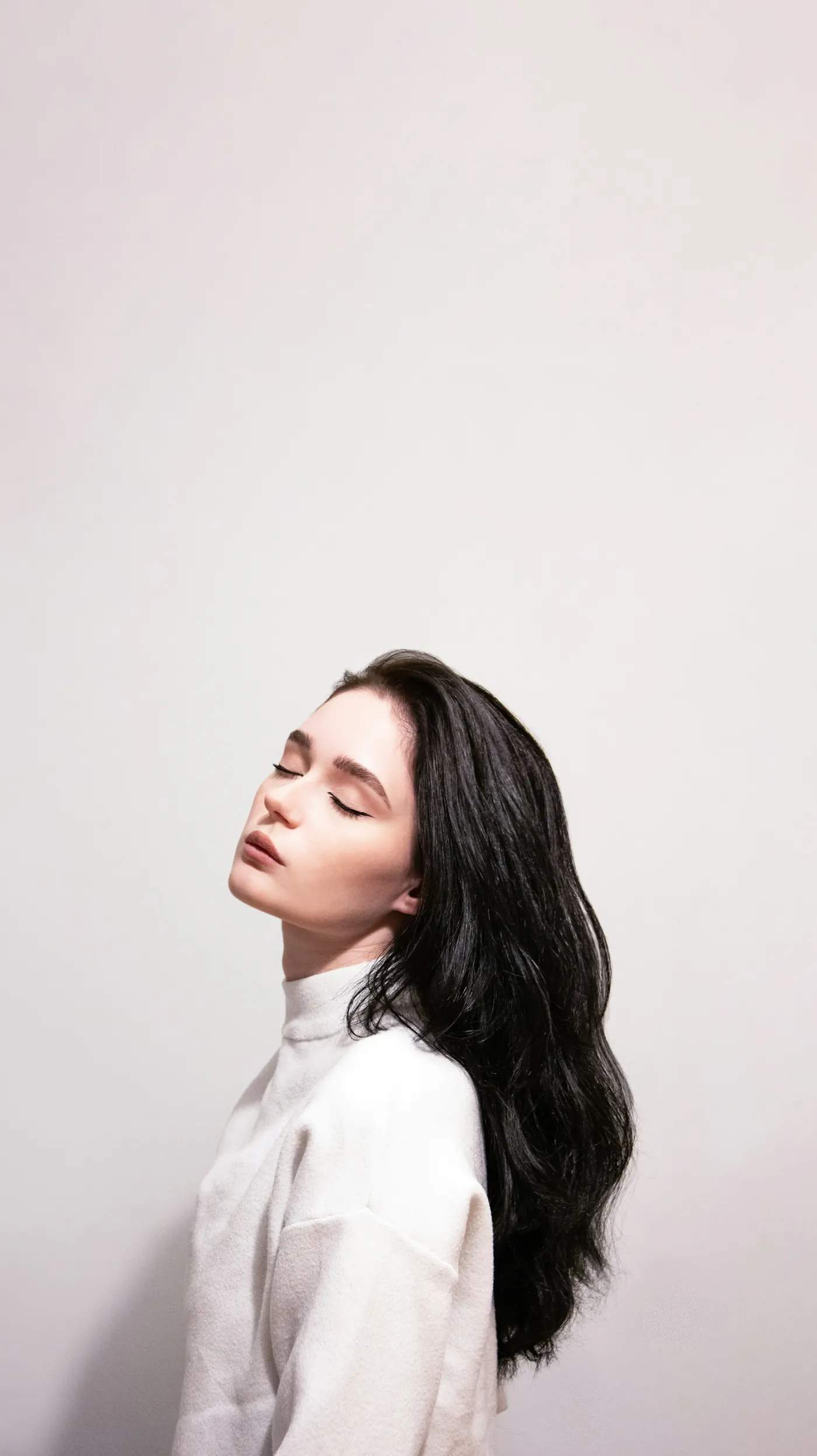 Woman with her eyes closed, calm and at ease