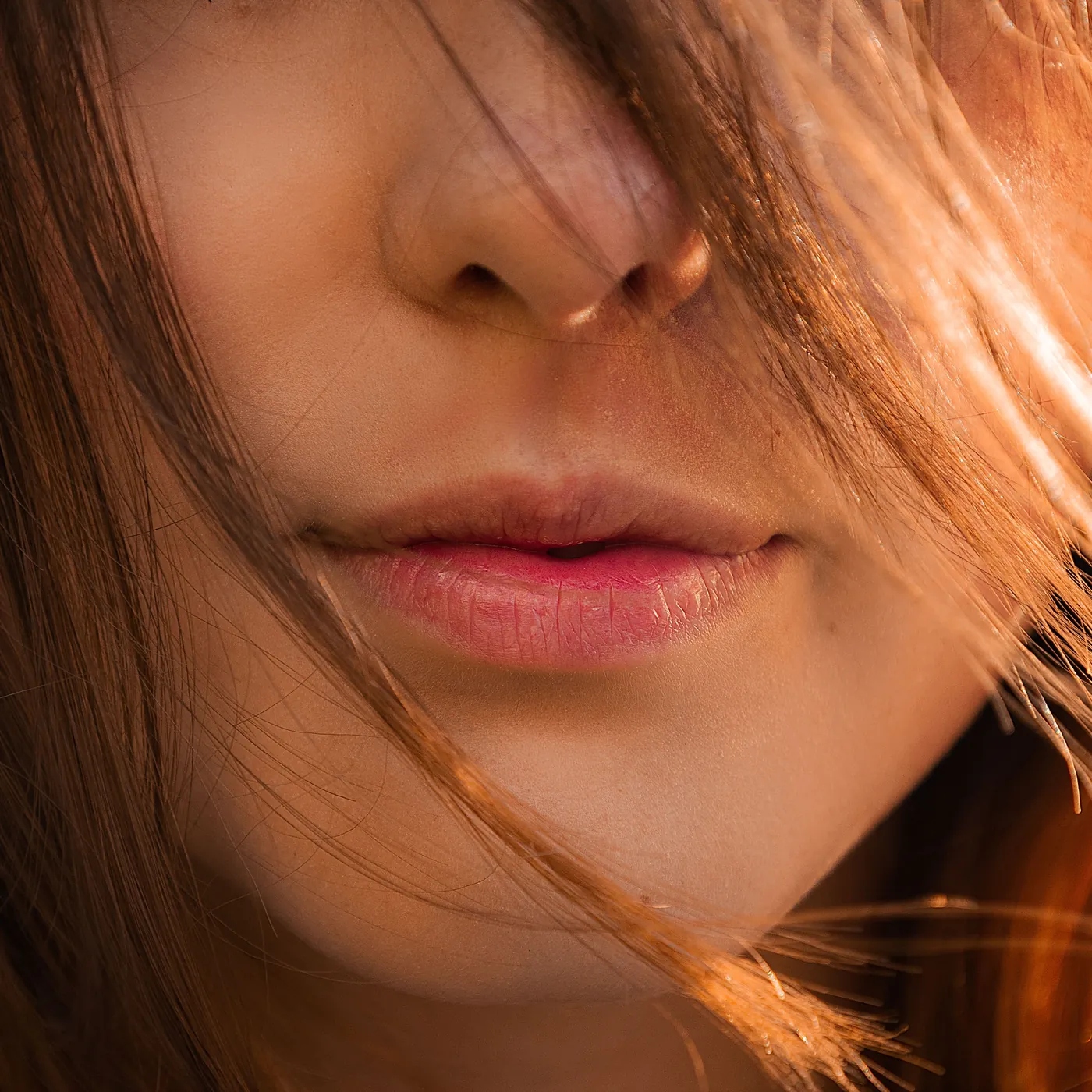 Close up of a woman's lips and smooth skin