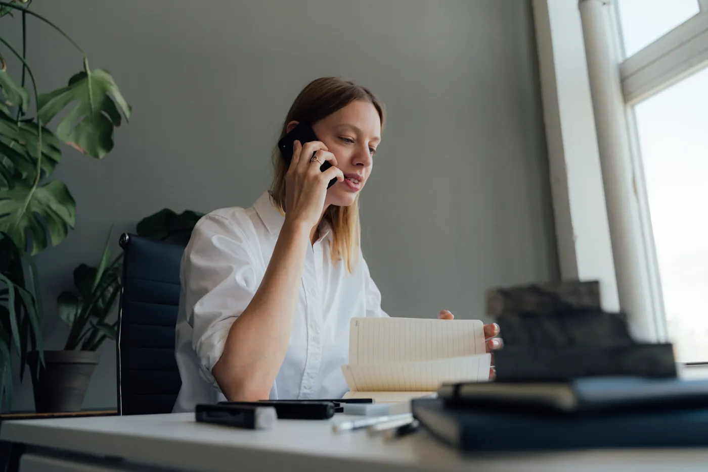 Woman on a phone consultation at her desk