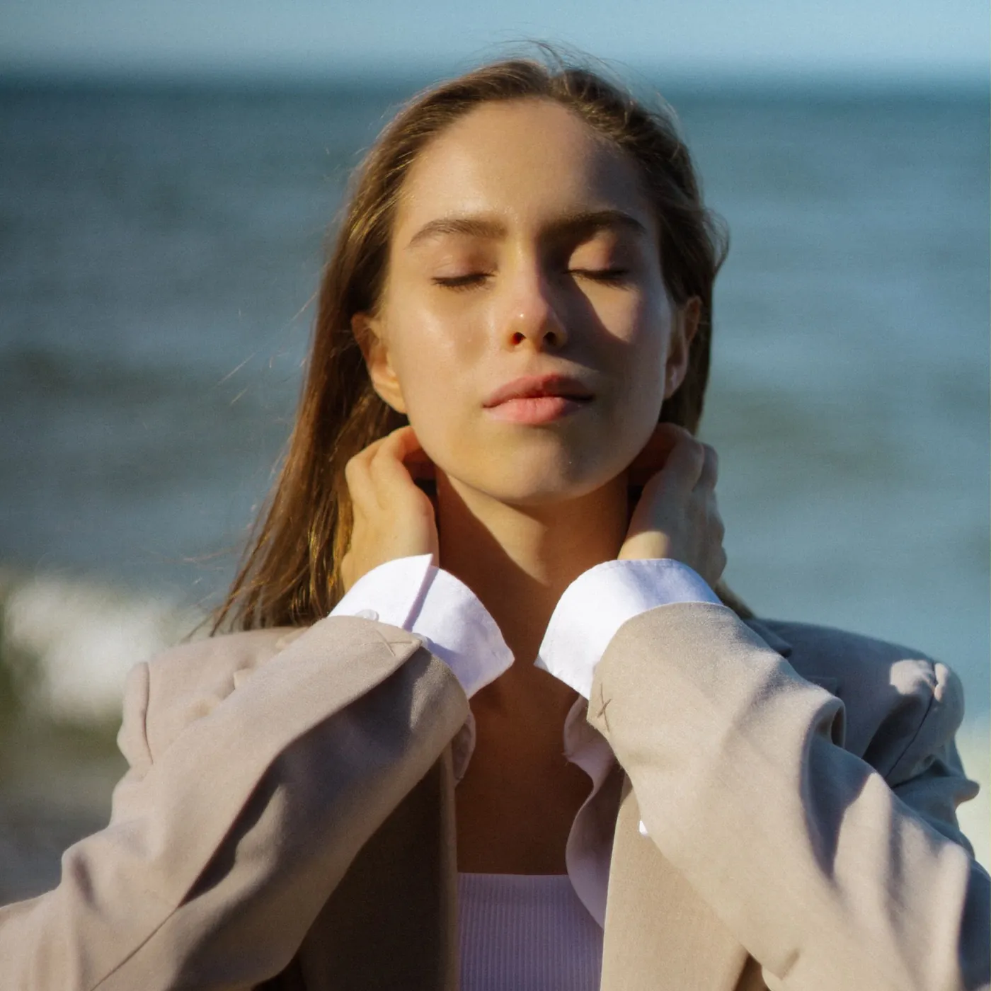 Calm woman with eyes closed in soft natural light
